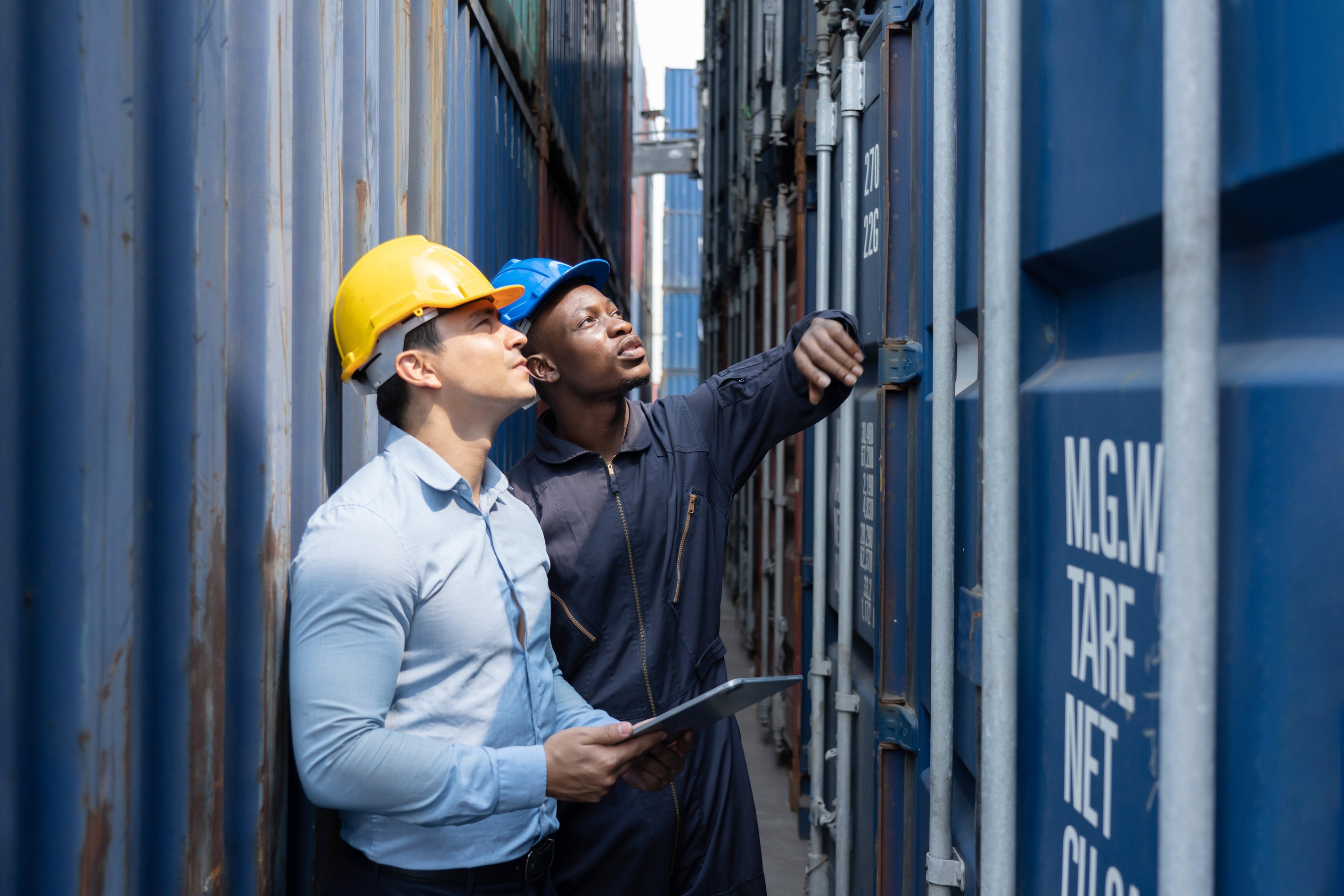 Men Inspecting Containers at the Port